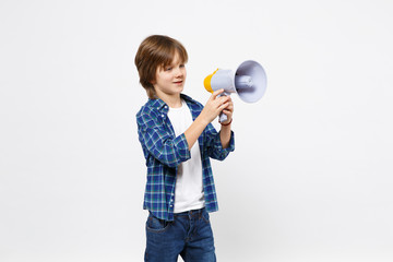 Fun little kid boy in blue t-shirt hold scream in megaphone, announces discounts sale isolated on white wall background children studio portrait. People childhood lifestyle concept. Mock up copy space