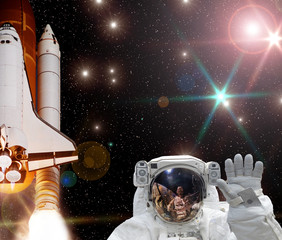 Rocket (shuttle), waving astronaut and galaxy. The elements of this image furnished by NASA.