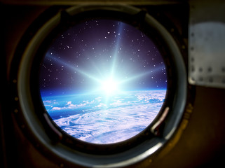 Fototapeta premium Sunrise, view from spaceship. Elements of this image furnished by NASA.