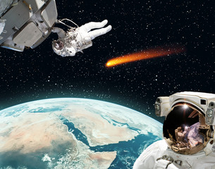 Astronaut and comet. The elements of this image furnished by NASA.