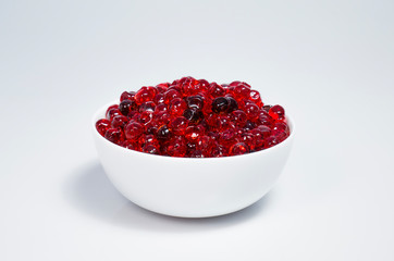 Red caviar in a cup on a white background