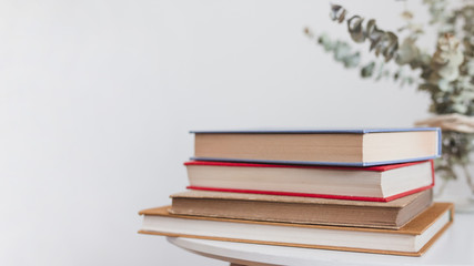 Stack of vintage hardcover books