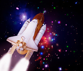 Big rocket (shuttle) lift off to stars and galaxies. The elements of this image furnished by NASA.