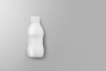 Small white plastic bottle with reflections and shadows on a gray studio background.