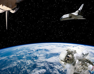 Astronaut and spaceships against earth. The elements of this image furnished by NASA.