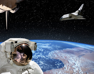 Astronaut looking at shuttle that flies in space. Other spaceship goes anywhere.  The elements of...