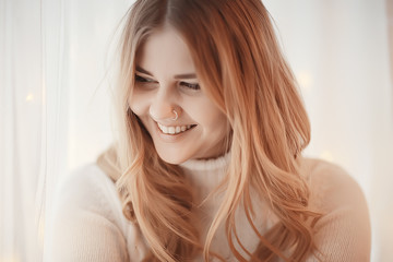 cute blonde sweater portrait / winter look, portrait of beautiful model with long hair in cold season