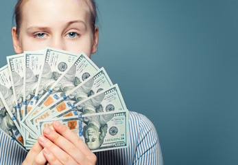 Money concept. US dollars banknote in female hands