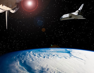 Shuttle flies in space. Other spaceship goes anywhere.  The elements of this image furnished by...