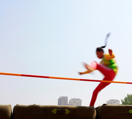 women high jump athletes in the playground
