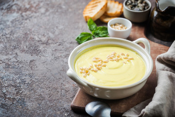 Vegetarian white cauliflower cream soup in a white bowl
