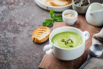 green soup in a white bowl