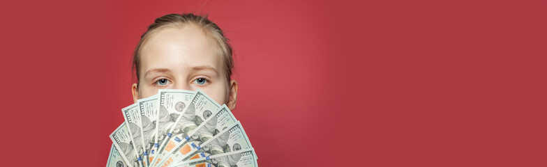 Girl showing US dollars money cash on pink banner background