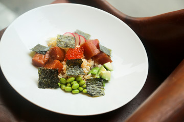 Salmon poke bowl with red caviar