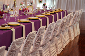 Serving a table at a wedding celebration