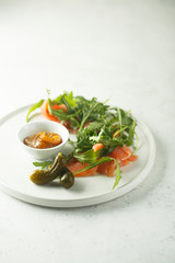 Smoked salmon arugula salad with pickles
