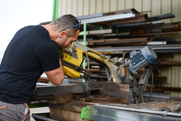 handsome man working in a workshop steel industry factory construction metallurgy machine site