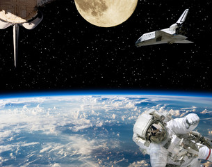 Astronaut, spaceships and moon. Earth on the backdrop. The elements of this image furnished by NASA.