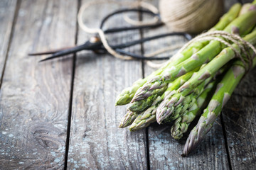 Bunch of fresh asparagus on wooden table