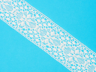 White lace on blue background