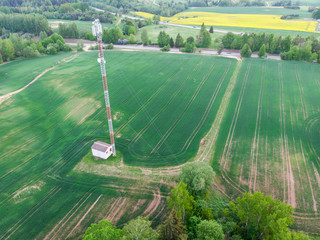 Aerial shot of mobile tower in fields