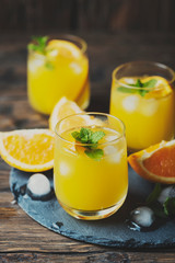 Obraz na płótnie Canvas Fresh summer cocktail with orange and mint