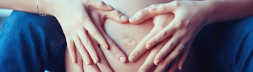 pregnancy concept childbirth and love / man and woman, big belly, hands in the shape of a heart, symbol of pregnancy and love