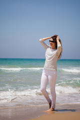 european girl having fun on the sea beach