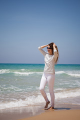 european girl having fun on the sea beach