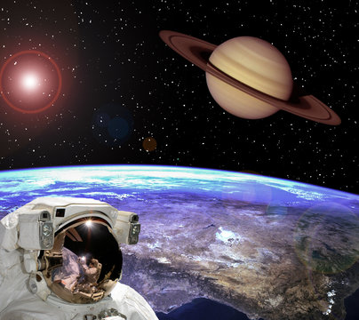 Astronaut staring at the saturn. Scene above earth. The elements of this image furnished by NASA.
