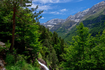Fototapeta na wymiar La Larry waterfalls in National Park of Ordesa and Monte Perdido. Valley of Pineta, Bielsa, Spain