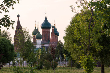 Fototapeta na wymiar Church Of Our Lady Of Tikhvin. The Church Of St. Nicholas. Silhouettes in the light of sunset. Yaroslavl.