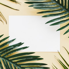 Flat lay of paper card template with leaves