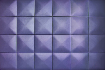 Rhombic light lilac color wall of big squares. Unusual, beautiful and modern background. Background consists of large light lilac squares.