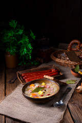 rustic sauerkraut soup with bacon and sausage