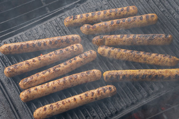Cooking sausages on the barbecue grill. Grilled sausages