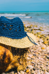 Summer straw hat on the beach