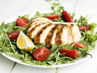 Grilled chicken breasts with vegetables