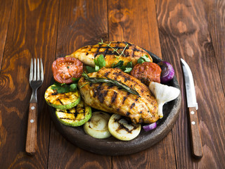 Grilled chicken breasts with vegetables