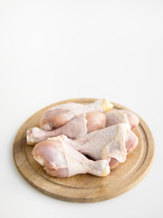 Raw chicken parts on a tray