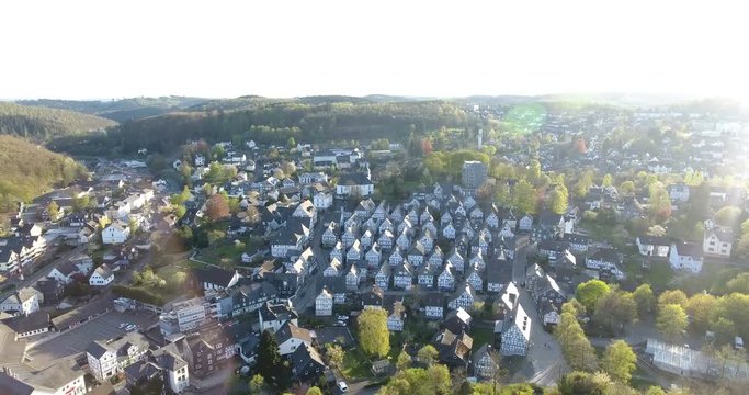 Aerial view, Rural scene with view of small village. Freudenberg Historic Housing. Suburbs seen from above. Copter footage of small town in Europe. 4k