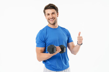 Attractive young fit sportsman wearing t-shirt standing