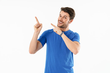 Attractive young fit sportsman wearing t-shirt standing