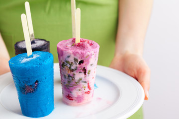 Homemade frozen ice cream popsicles from fruits
