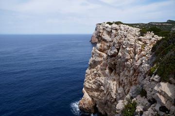 Capo Caccia, Foradada Island. Imposing white limestone cliff, in Sardinia/Sardegna, Italy