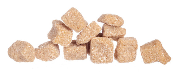 Brown cane sugar cubes isolated on white background
