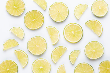 Lime fruit slices on white background.