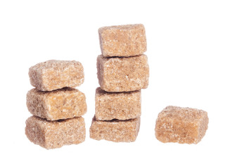 Brown cane sugar cubes isolated on white background