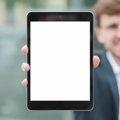 Close-up of businessman showing white screen display digital tablet