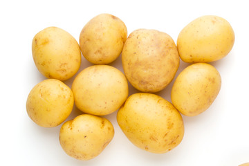 New potato and rosemarin isolated on white background close up.